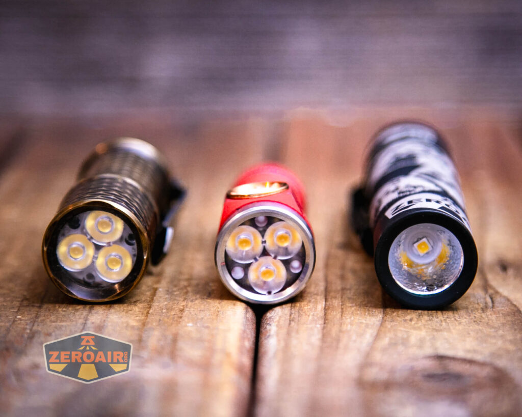 Emisar D3AA 5700K flashlight with two standard sized flashlights