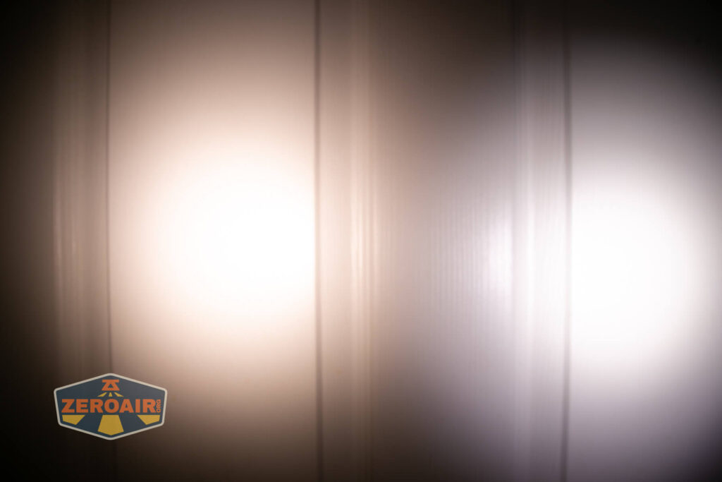 Emisar D3AA 5700K flashlight beamshots on door (at 1') compared to nichia 219b 4500K