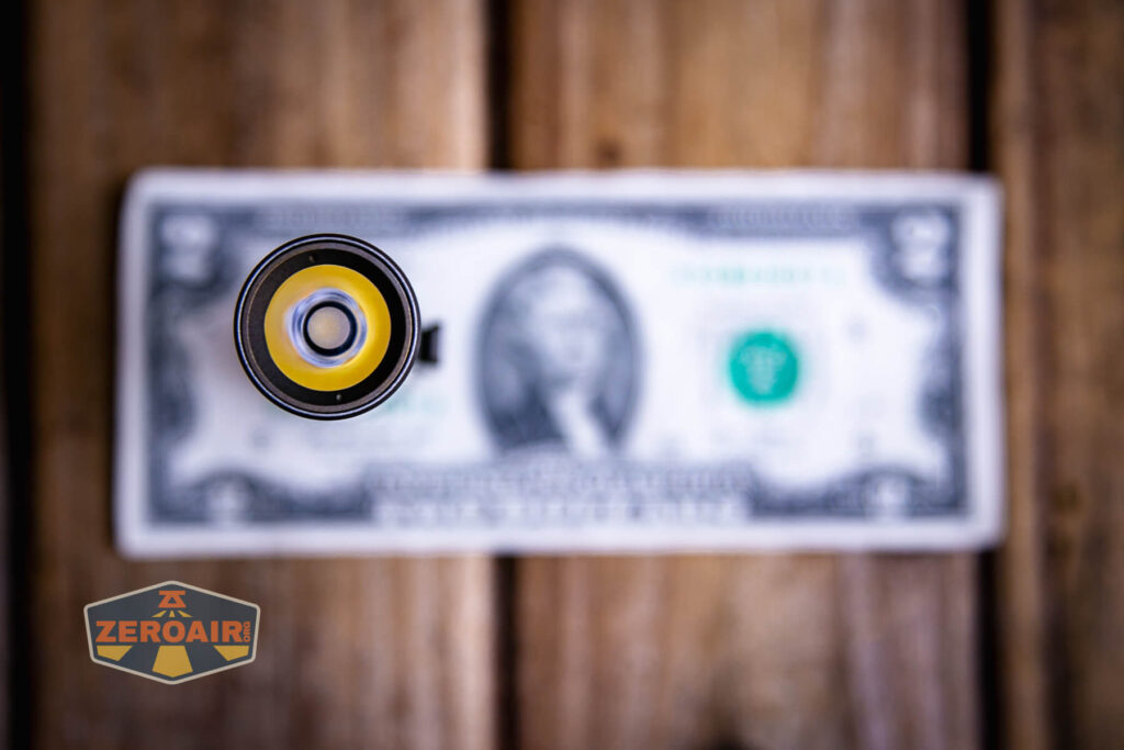Exceed Designs Rampant R8 flashlight on a two dollar bill