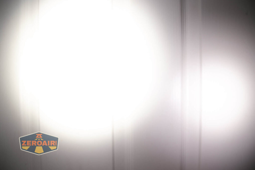 Exceed Designs Rampant R8 flashlight beamshots on door (at 1') compared to nichia 219b 4500K