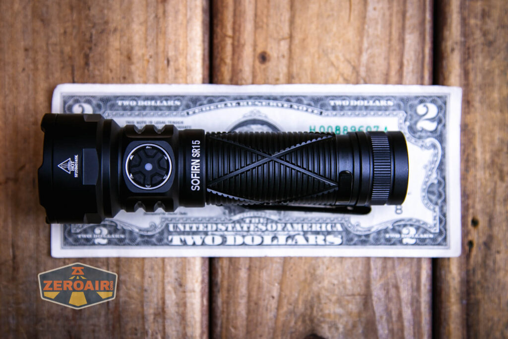 Sofirn SR15 rechargeable flashlight on a two dollar bill