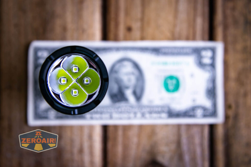 Sofirn SR15 rechargeable flashlight on a two dollar bill