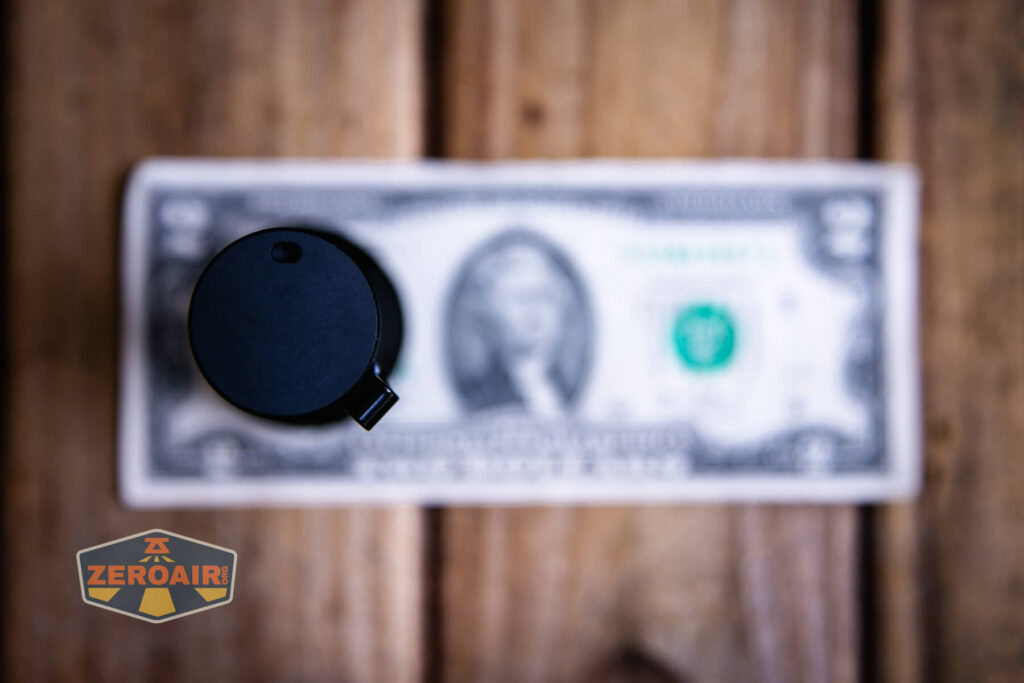 Sofirn SR15 rechargeable flashlight on a two dollar bill