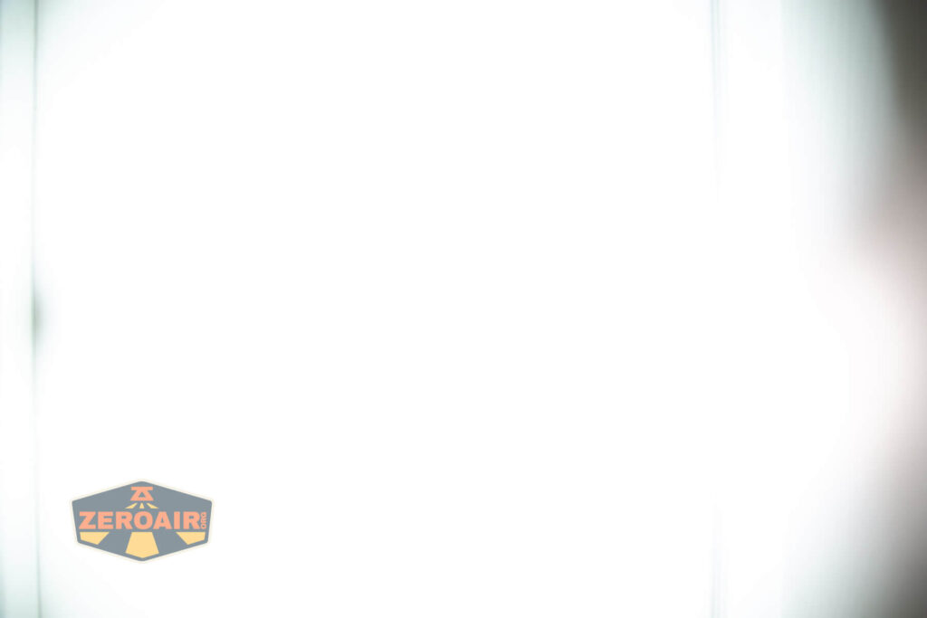 Sofirn SR15 rechargeable flashlight beamshots on door (at 1') compared to nichia 219b 4500K