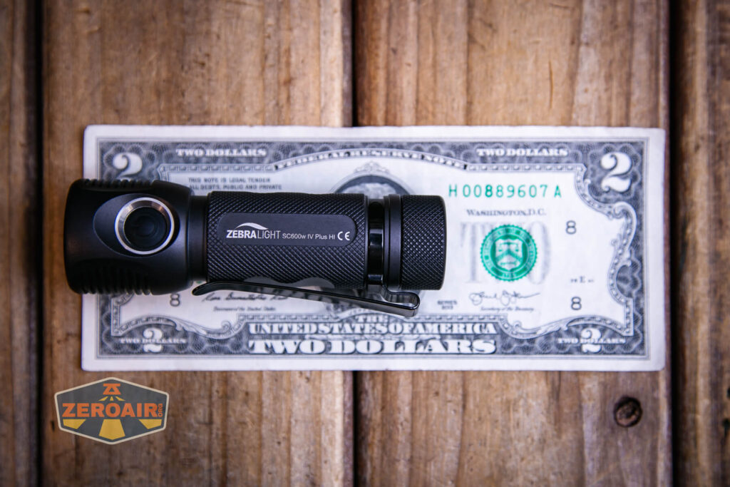 Zebralight SC600w IV Plus HI flashlight on a two dollar bill
