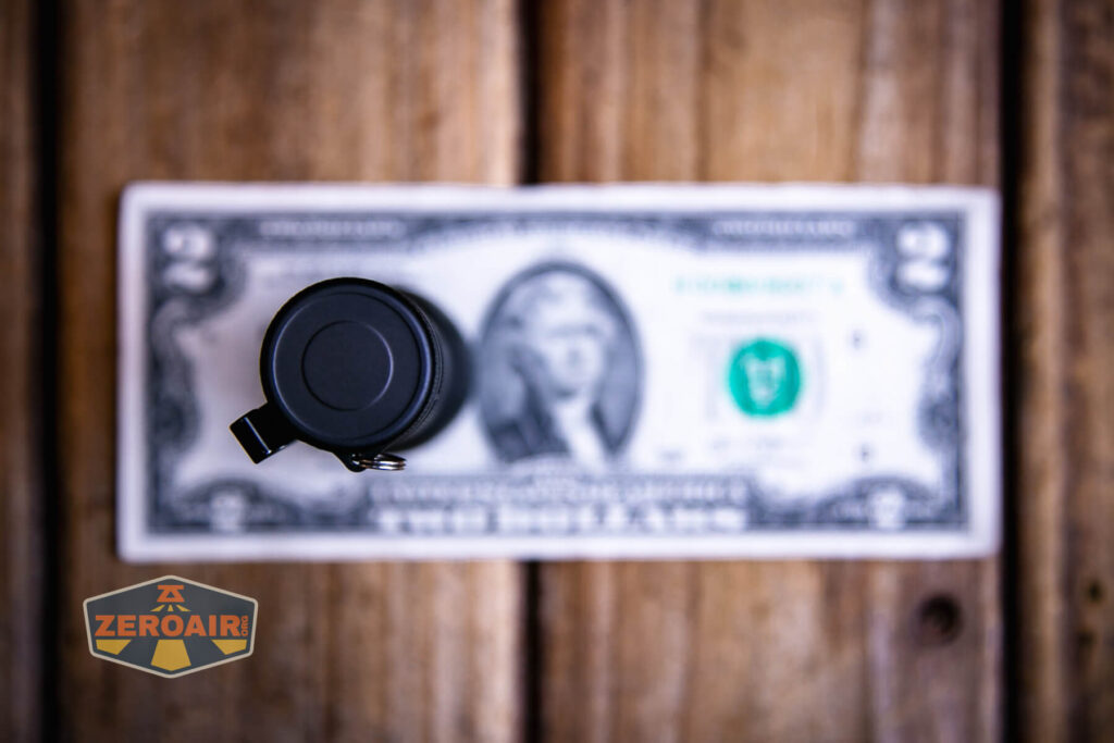 Zebralight SC600w IV Plus HI flashlight on a two dollar bill