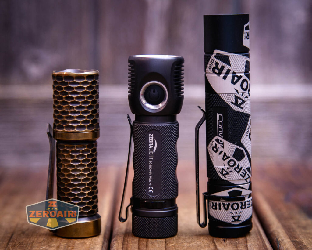 Zebralight SC600w IV Plus HI flashlight with two standard sized flashlights