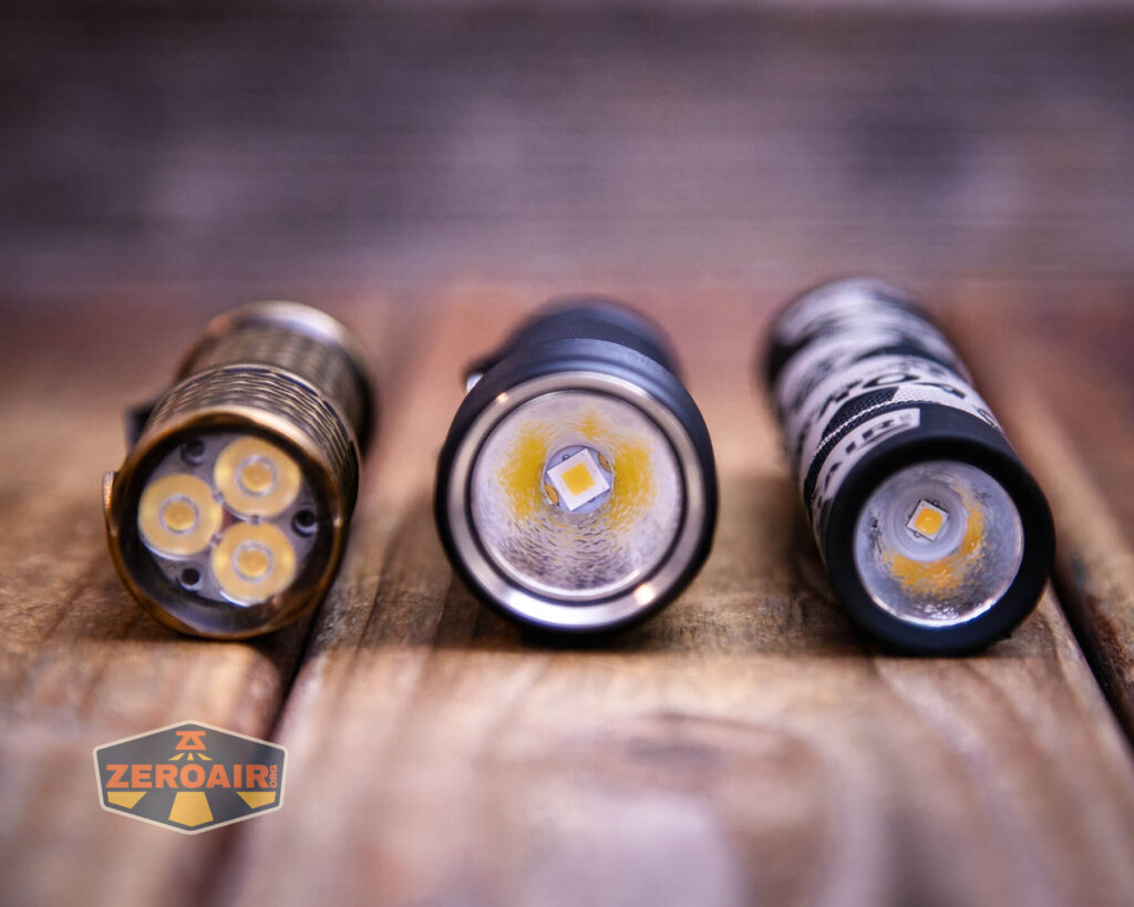 Zebralight SC600w IV Plus HI flashlight with two standard sized flashlights