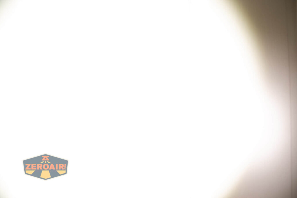 Zebralight SC600w IV Plus HI flashlight beamshots on door (at 1') compared to nichia 219b 4500K