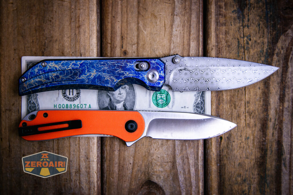 Kansept Eaglestrike knife on a two dollar bill compared to Civivi Elementum in orange