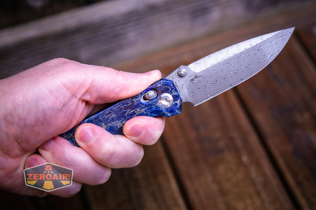 Kansept Eaglestrike knife open in hand