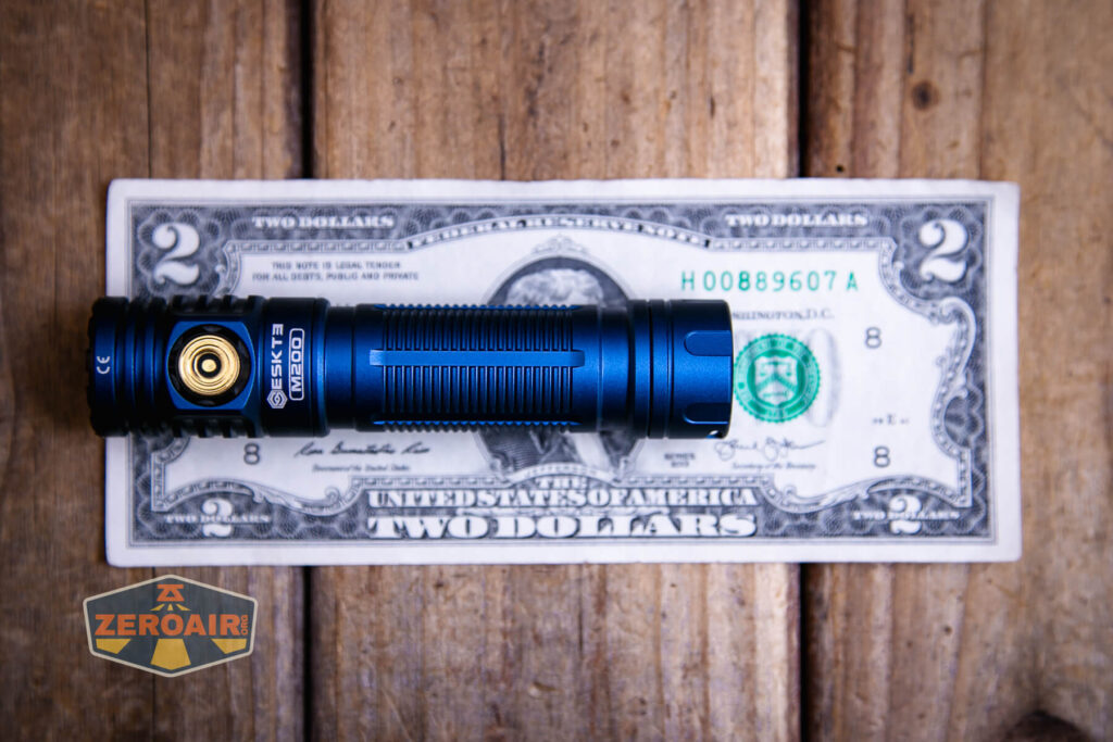 Skilhunt M200 V4 flashlight on a two dollar bill