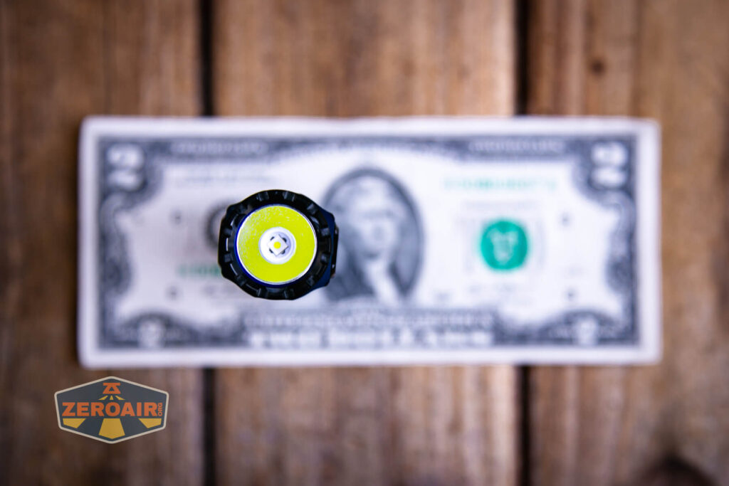 Skilhunt M200 V4 flashlight on a two dollar bill