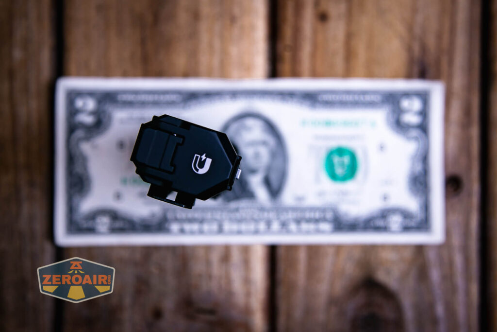 Wuben X4 flashlight on a two dollar bill