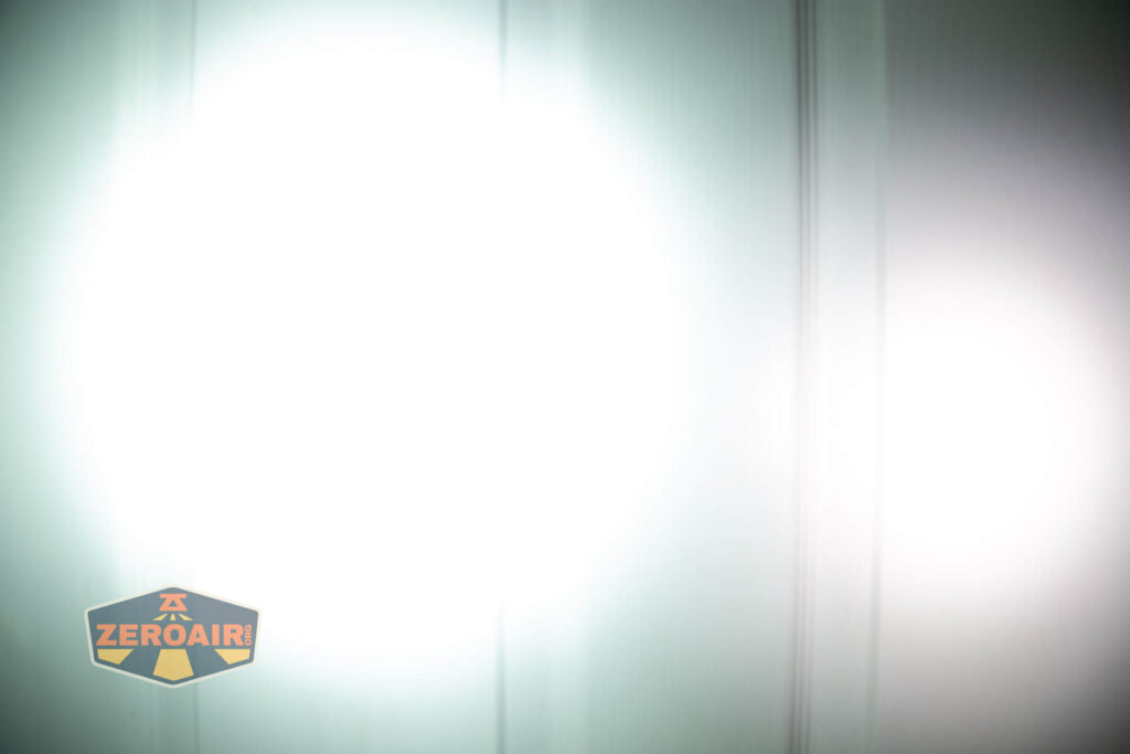 Wuben X4 flashlight beamshots on door (at 1') compared to nichia 219b 4500K