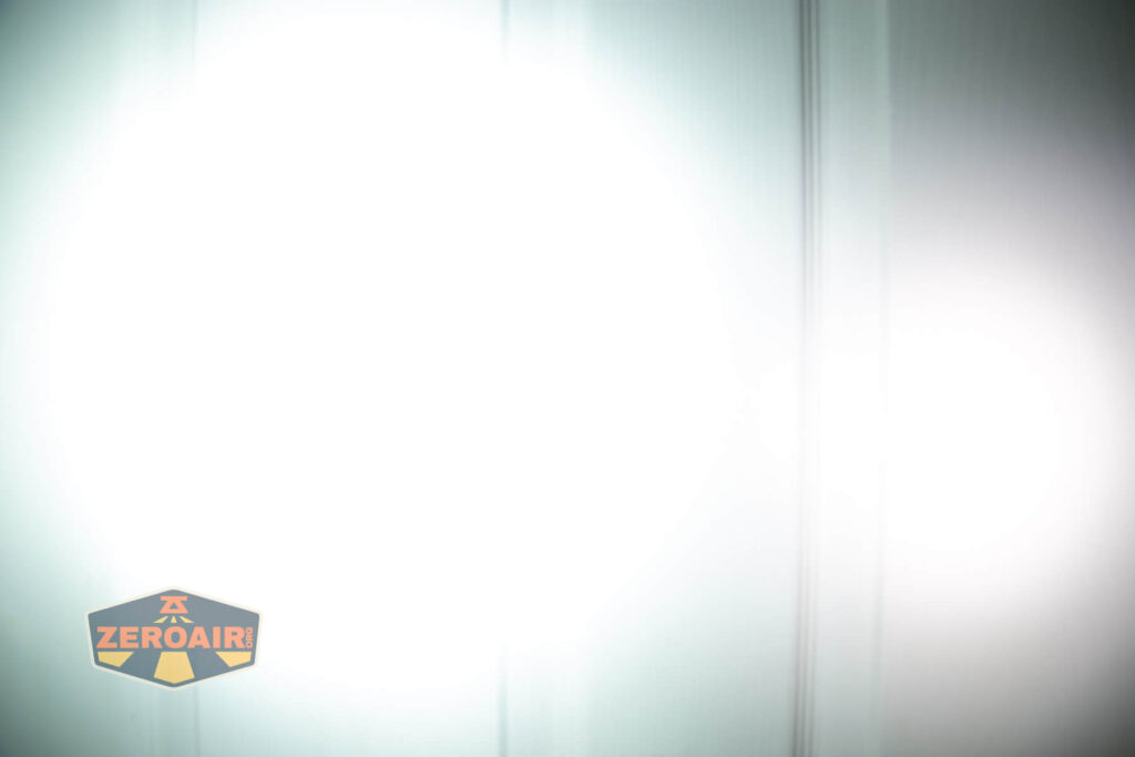 Wuben X4 flashlight beamshots on door (at 1') compared to nichia 219b 4500K