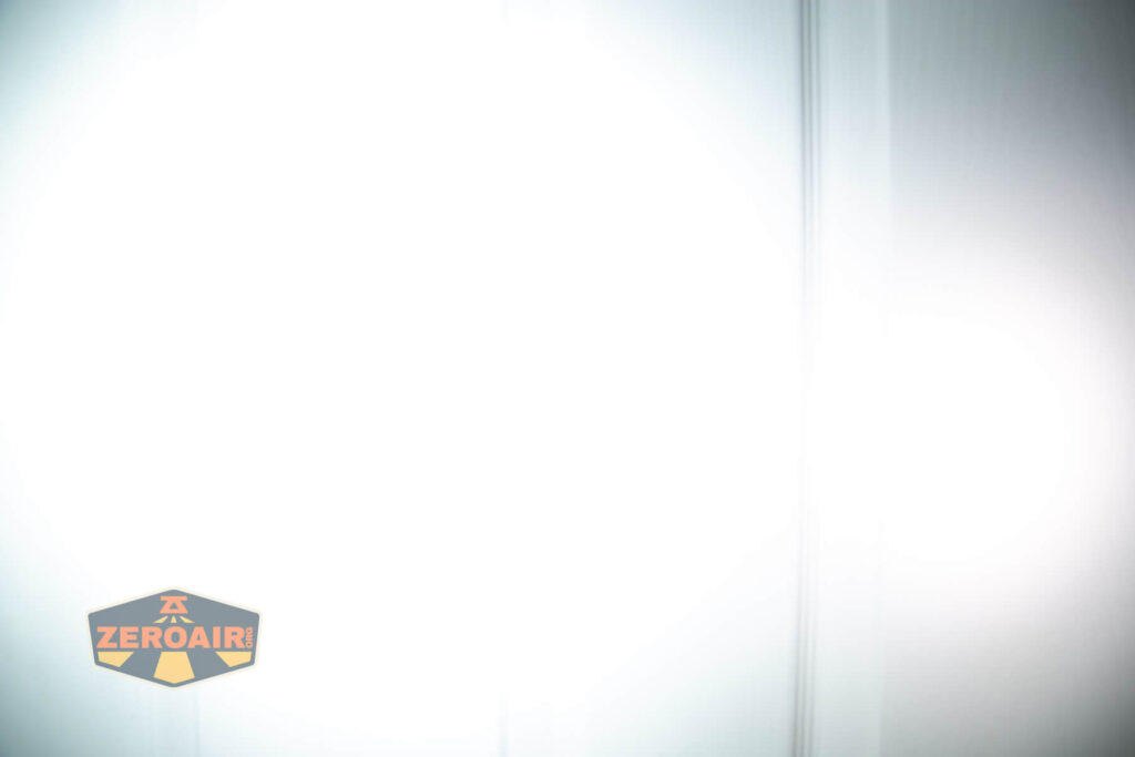 Wuben X4 flashlight beamshots on door (at 1') compared to nichia 219b 4500K