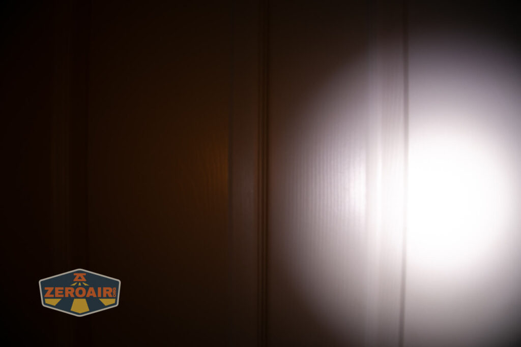 Wuben X4 flashlight beamshots on door (at 1') compared to nichia 219b 4500K
