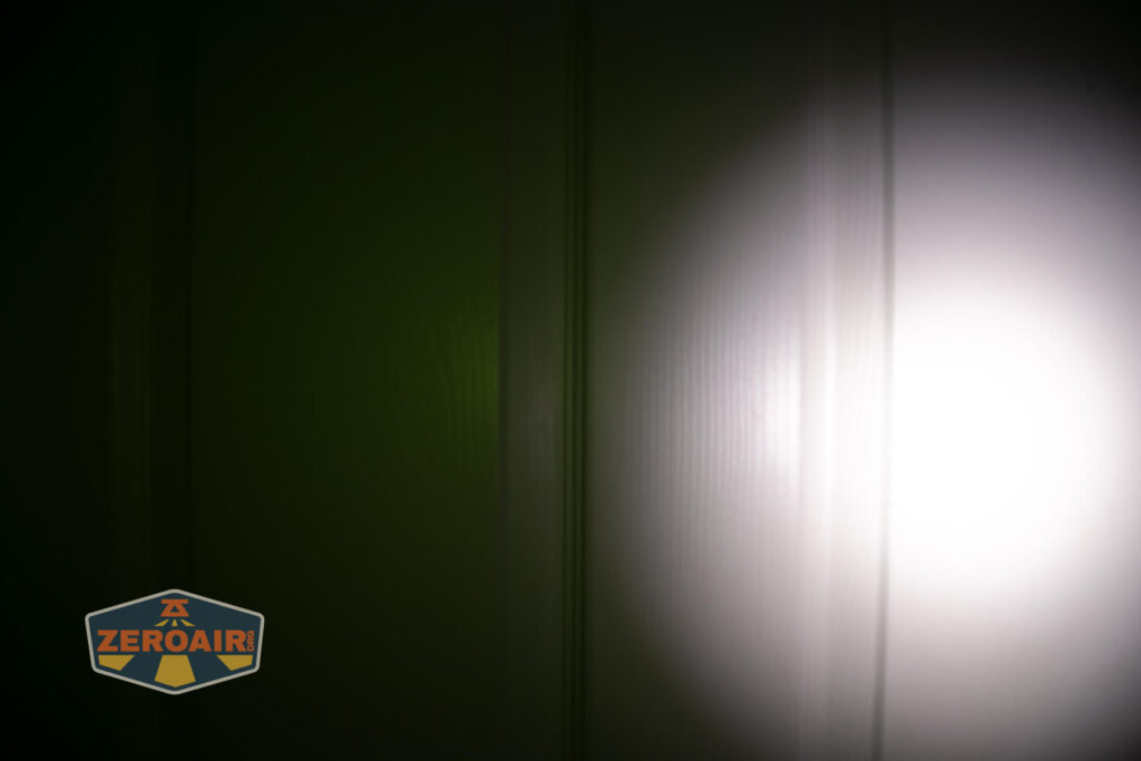 Wuben X4 flashlight beamshots on door (at 1') compared to nichia 219b 4500K