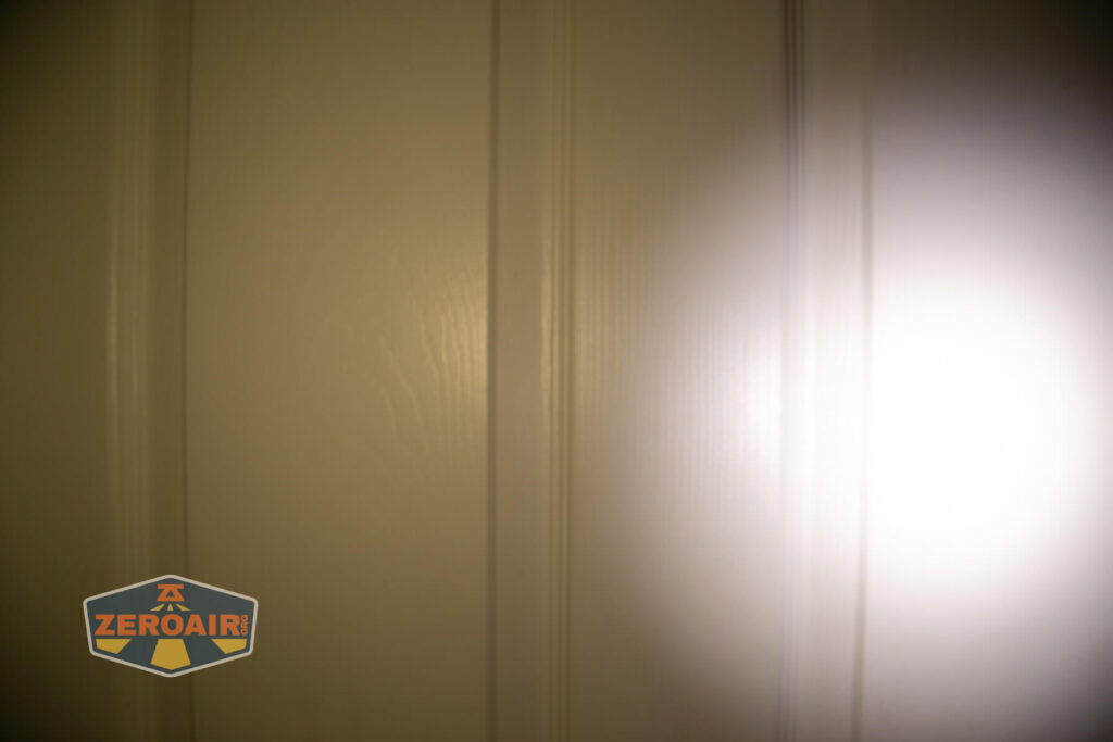 Wuben X4 flashlight beamshots on door (at 1') compared to nichia 219b 4500K