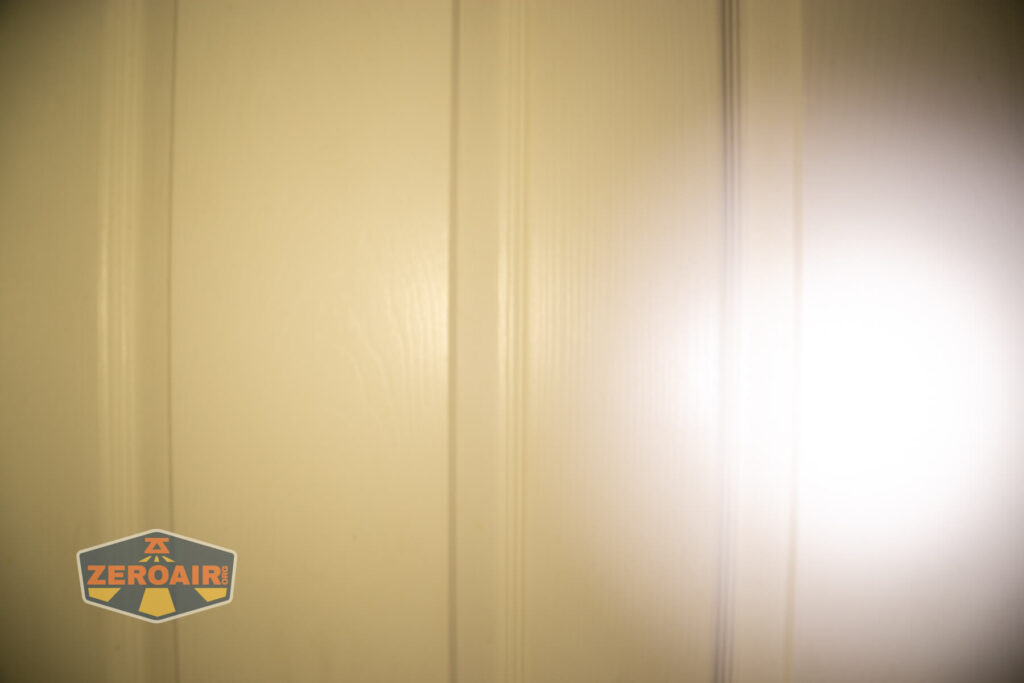 Wuben X4 flashlight beamshots on door (at 1') compared to nichia 219b 4500K