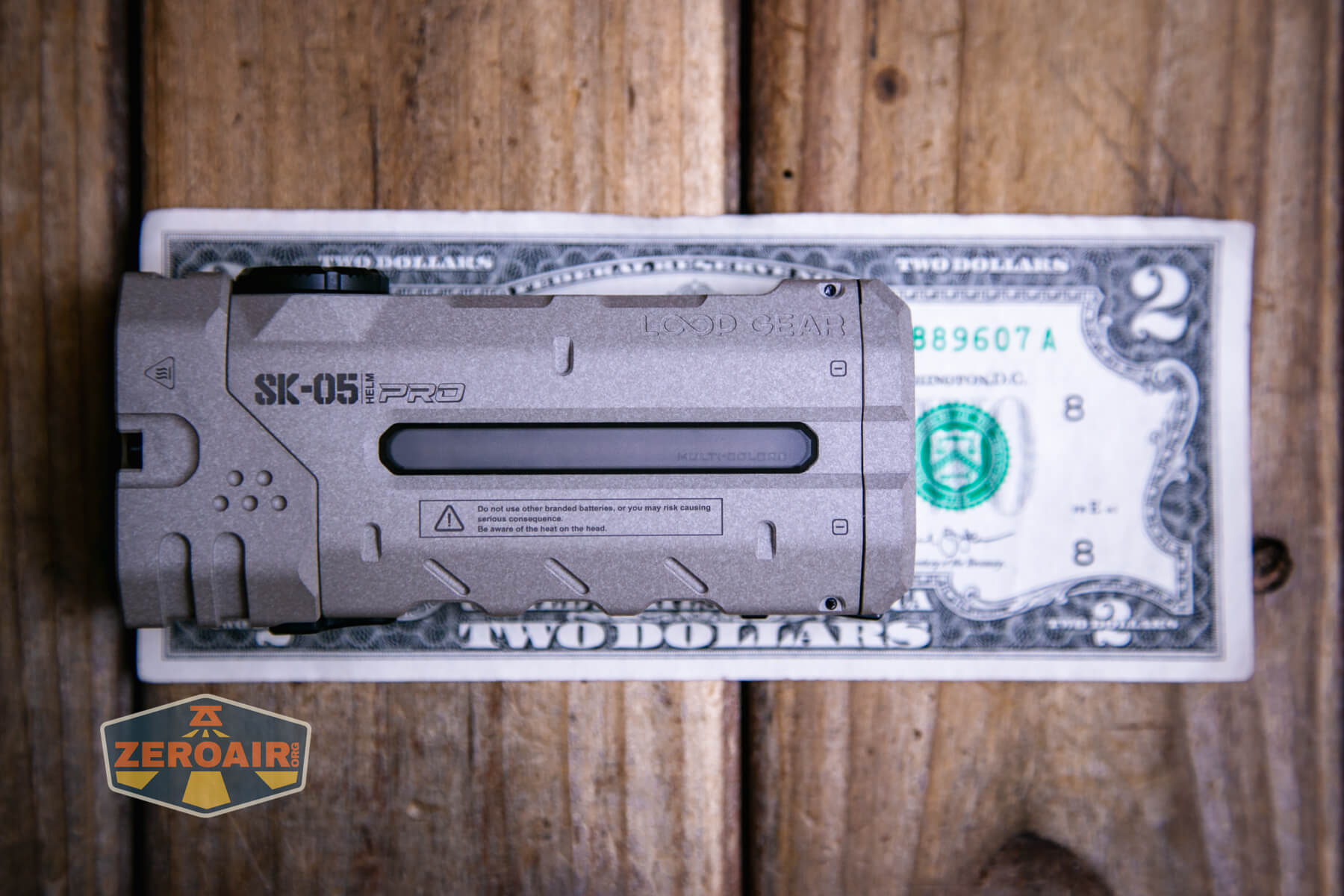 LoopGear SK-05 Pro MAO flashlight on a two dollar bill