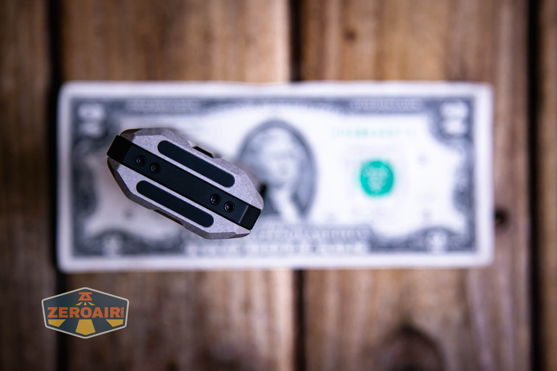 LoopGear SK-05 Pro MAO flashlight on a two dollar bill