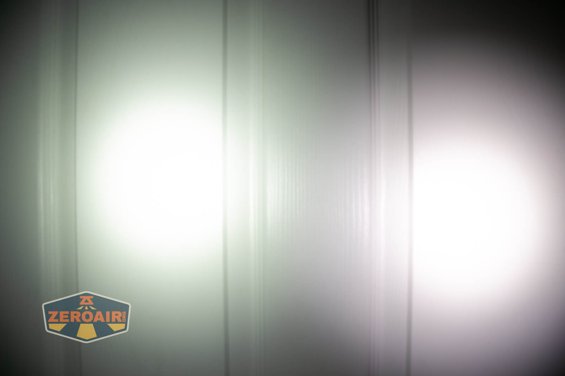 LoopGear SK-05 Pro MAO flashlight beamshots on door (at 1') compared to nichia 219b 4500K