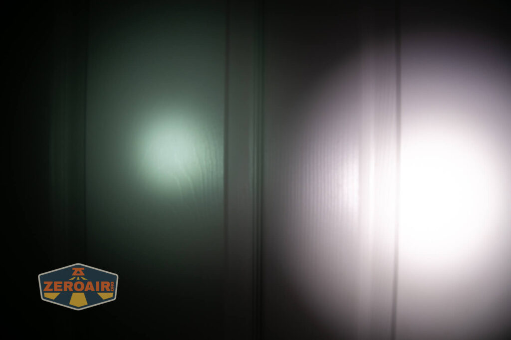 Nitecore HC65 UHE headlamp beamshots on door (at 1') compared to nichia 219b 4500K