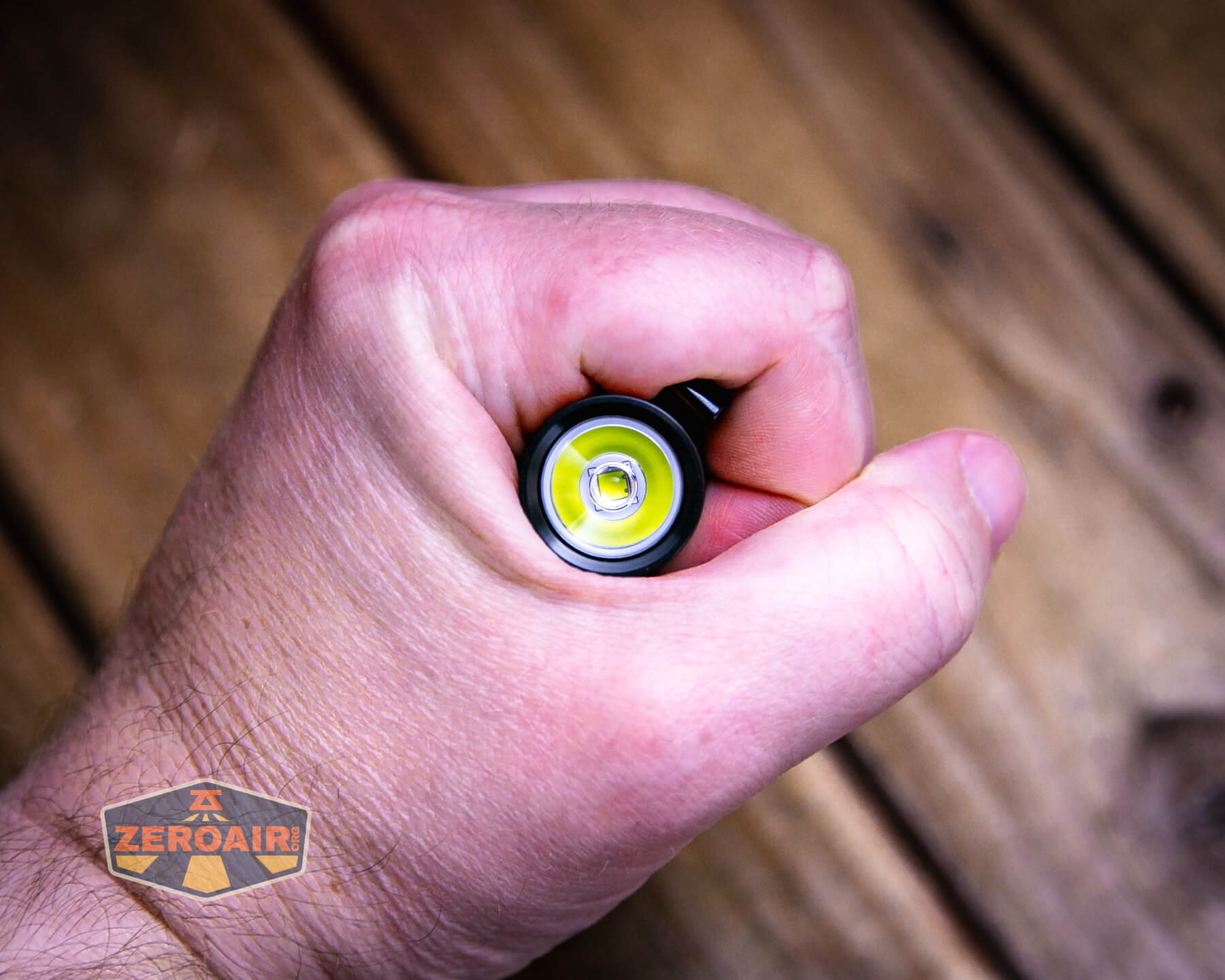 Olight Baton 4 Premium flashlight in hand