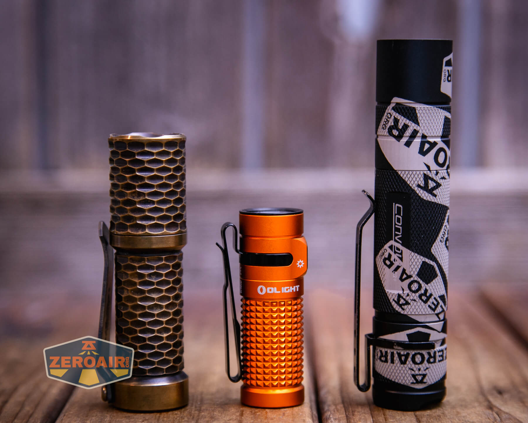 Olight Baton 4 Premium flashlight with two standard sized flashlights