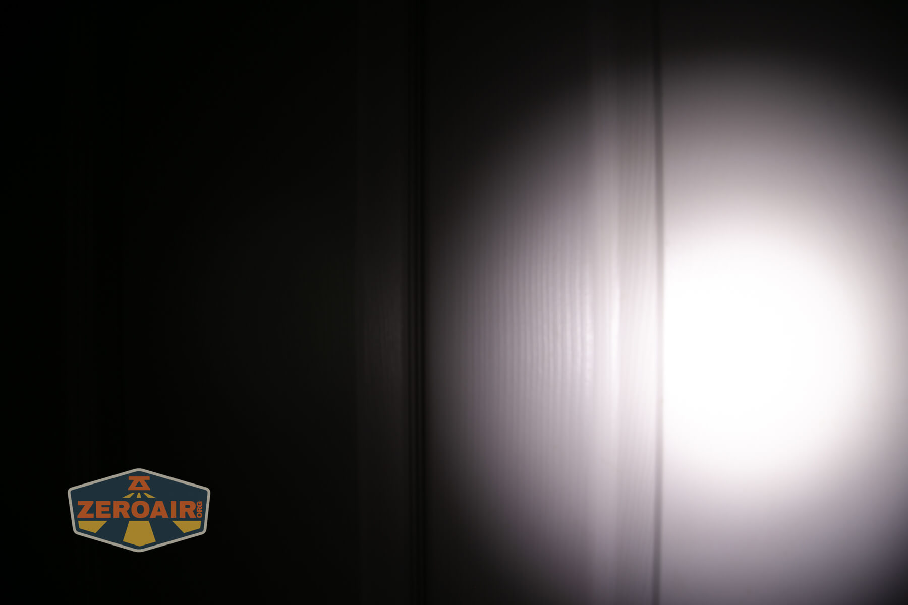 Olight Baton 4 Premium flashlight beamshots on door (at 1') compared to nichia 219b 4500K