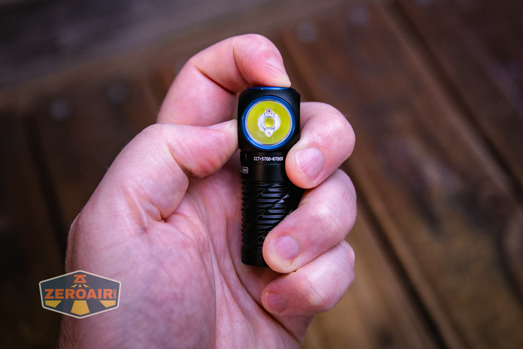 Olight Perun 3 Mini cool white headlamp in hand