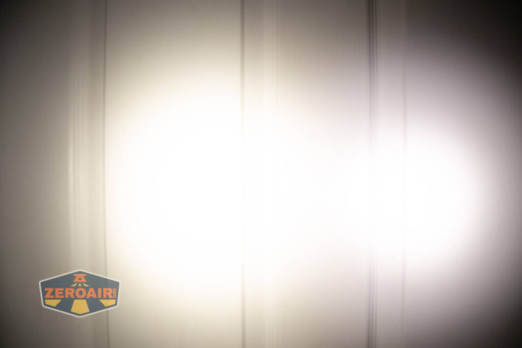 Skilhunt EC150 Nichia 519a flashlight beamshots on door compared to nichia 219b