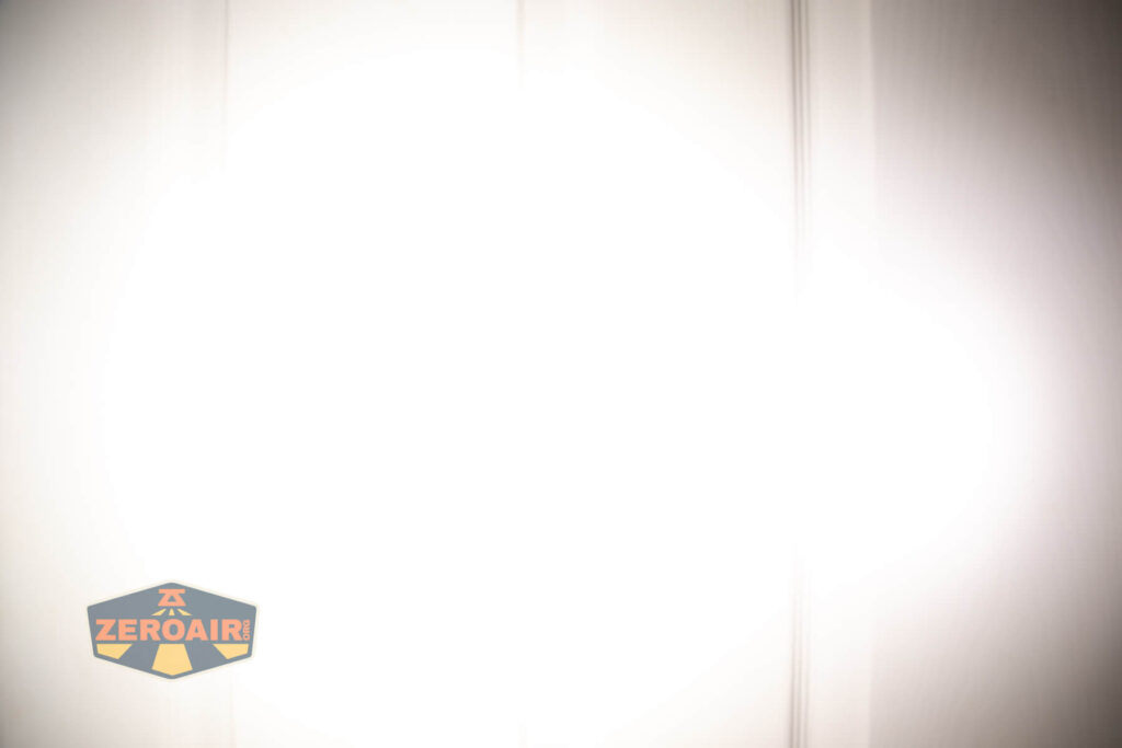 Skilhunt EC150 Nichia 519a flashlight beamshots on door compared to nichia 219b