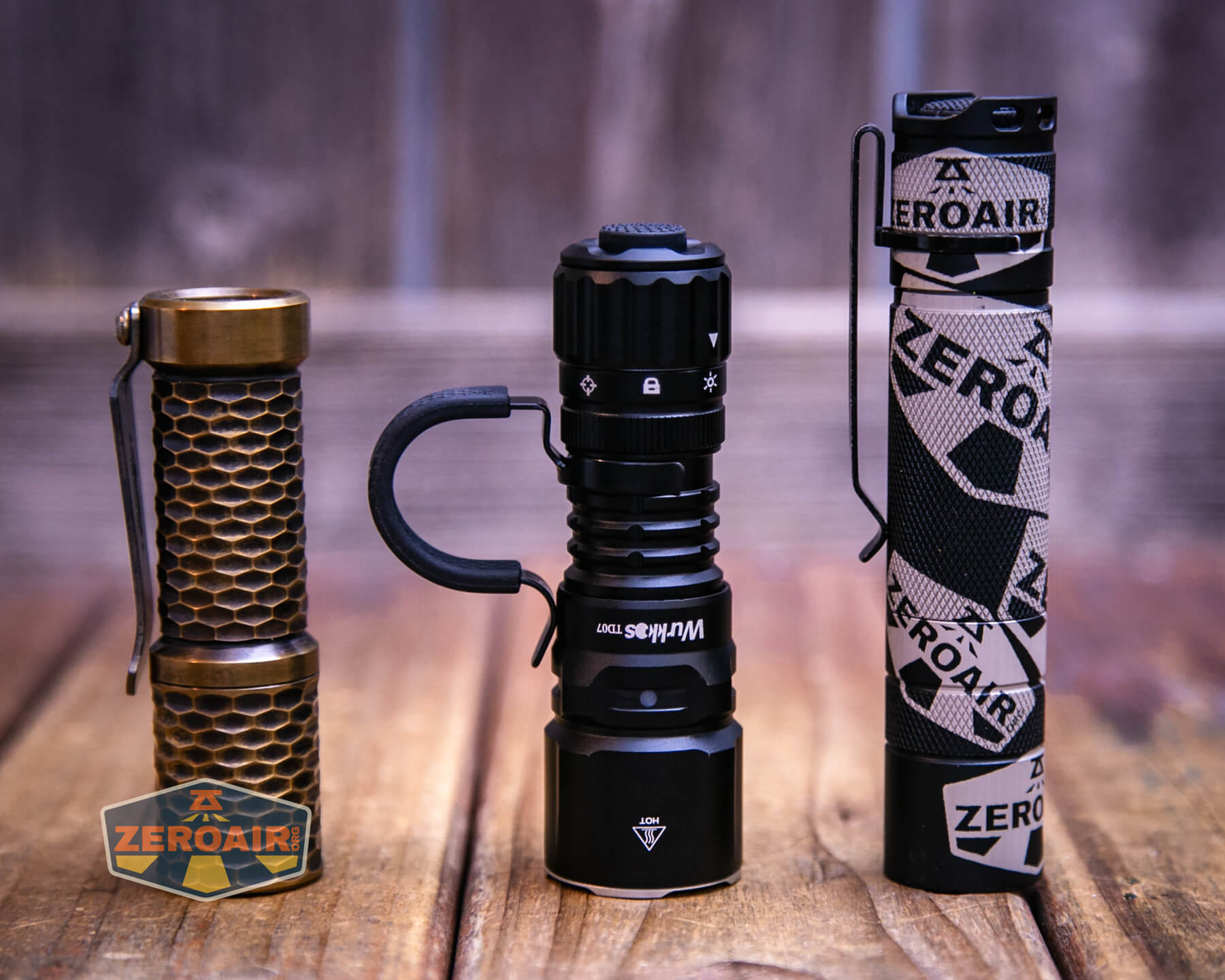 Wurkkos TD07 tactical flashlight with two standard sized flashlights