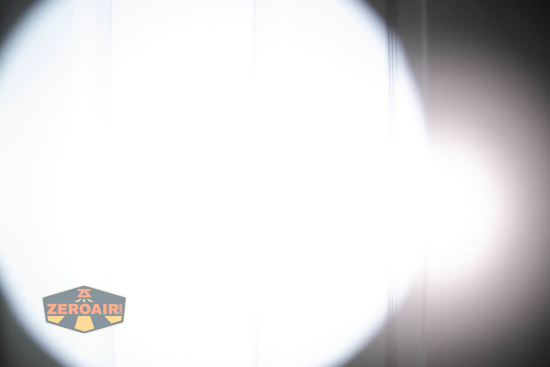 Wurkkos TD07 tactical flashlight beamshots on door (at 1') compared to nichia 219b 4500K