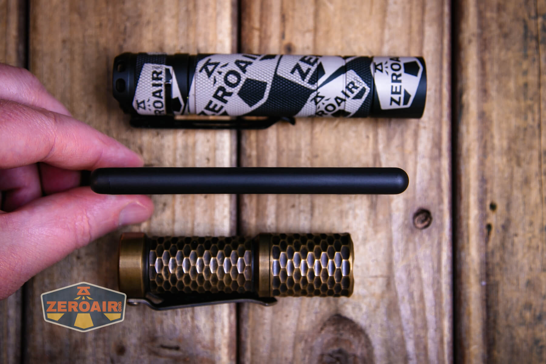 Nitecore NB Air power bank with two standard sized flashlights