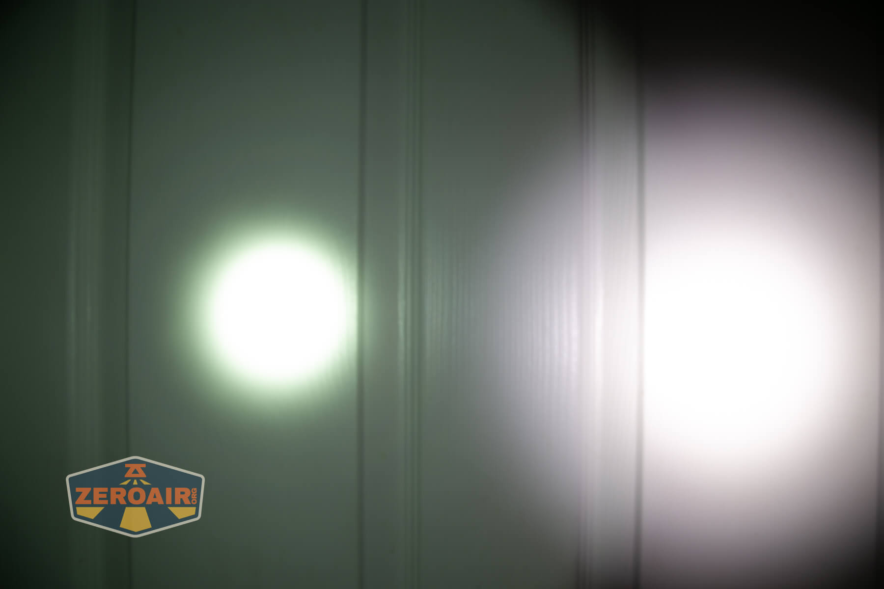 Skilhunt M150v4 Luminus SFT25R flashlight beamshots on door (at 1') compared to nichia 219b 4500K