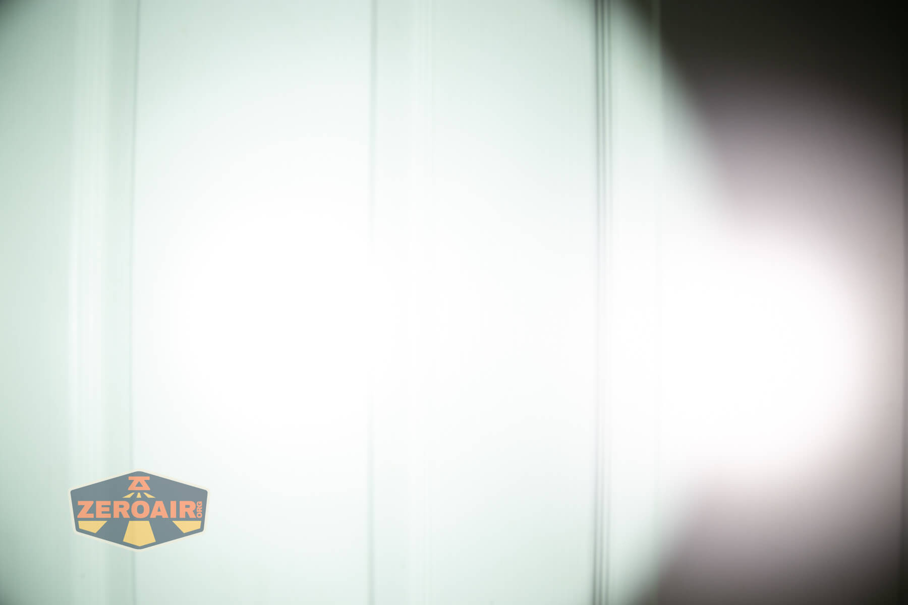 Skilhunt M150v4 Luminus SFT25R flashlight beamshots on door (at 1') compared to nichia 219b 4500K