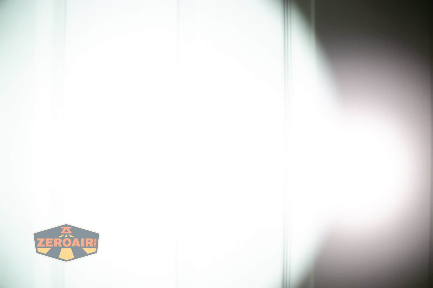 Skilhunt M150v4 Luminus SFT25R flashlight beamshots on door (at 1') compared to nichia 219b 4500K