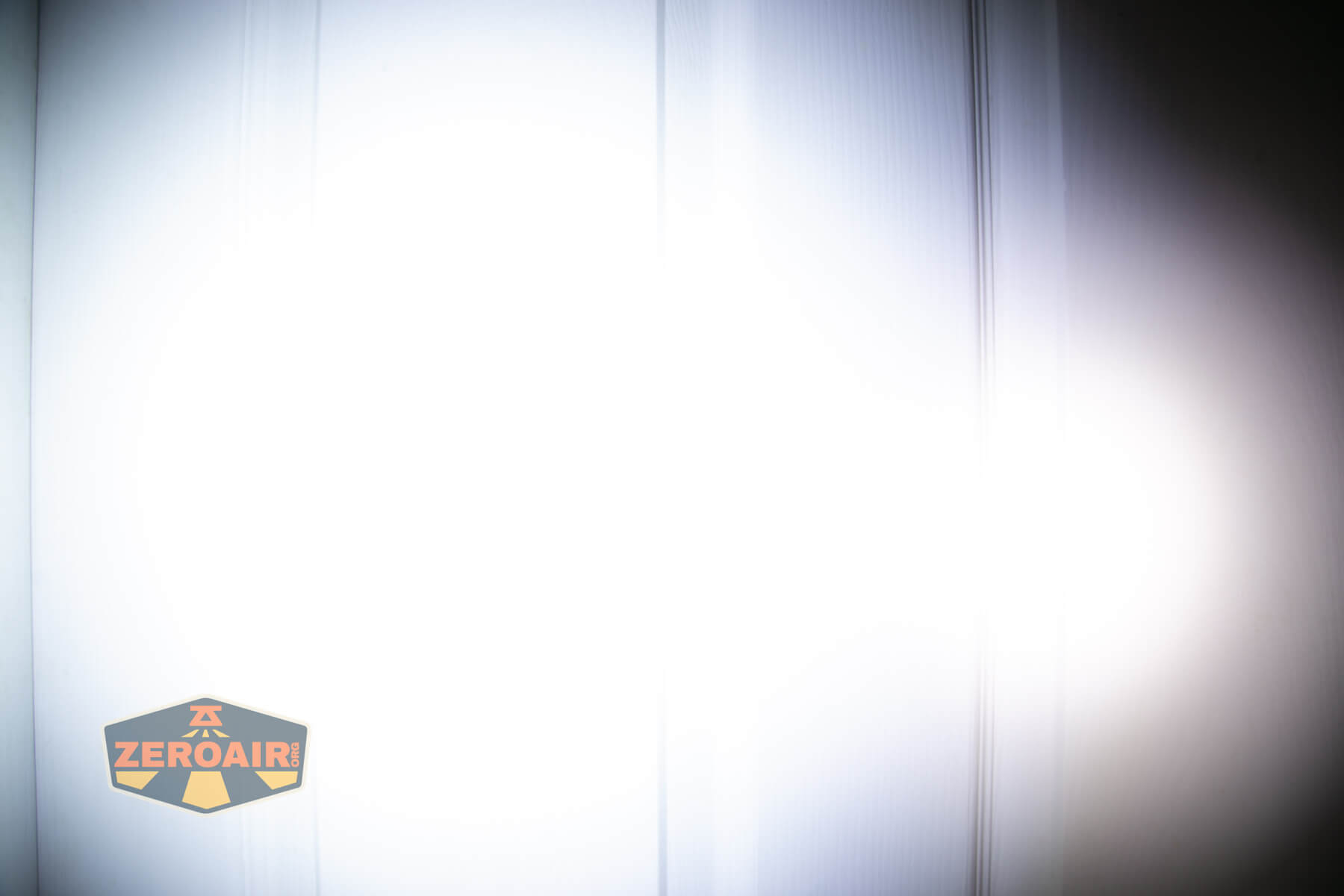 Thrunite Defender flashlight beamshots on door (at 1') compared to nichia 219b 4500K