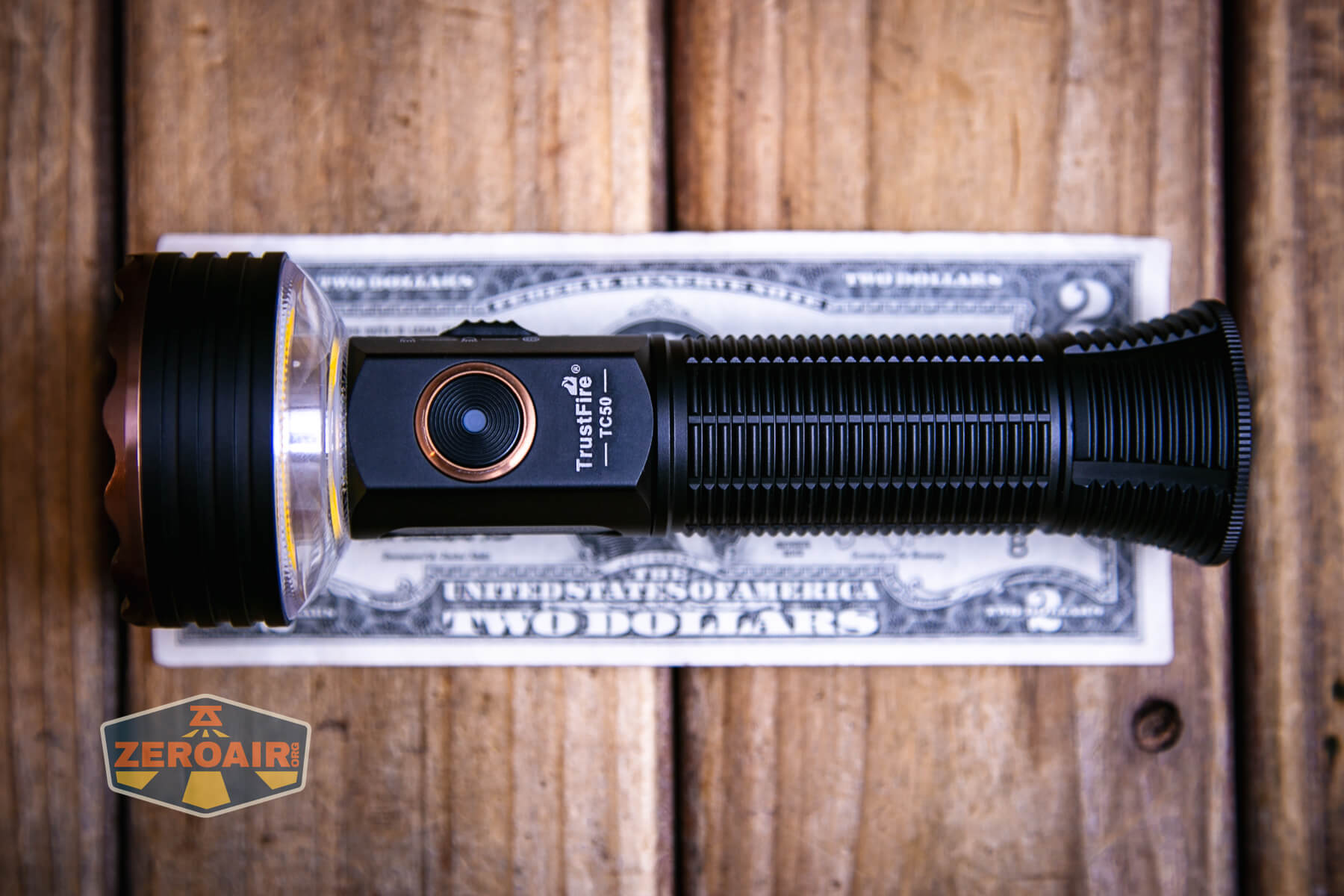 Trustfire TC50 camping flashlight on two dollar bill