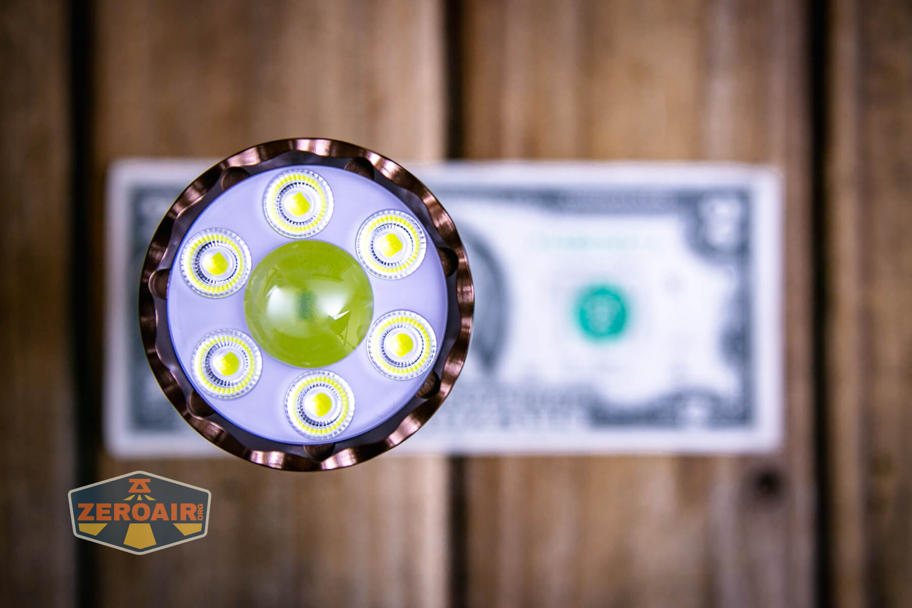 Trustfire TC50 camping flashlight on two dollar bill