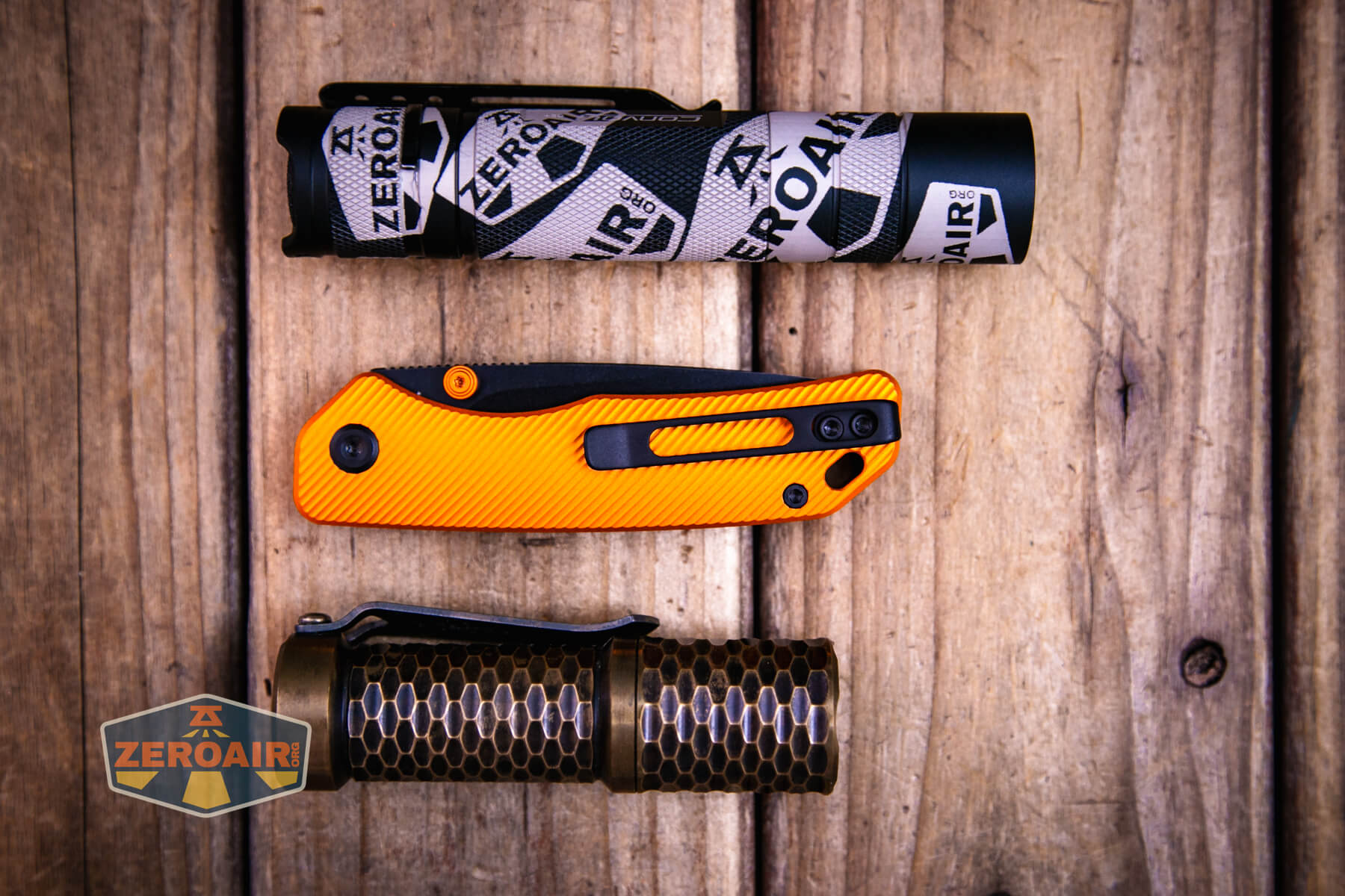 Vosteed Marten top liner lock knife with two standard sized flashlights