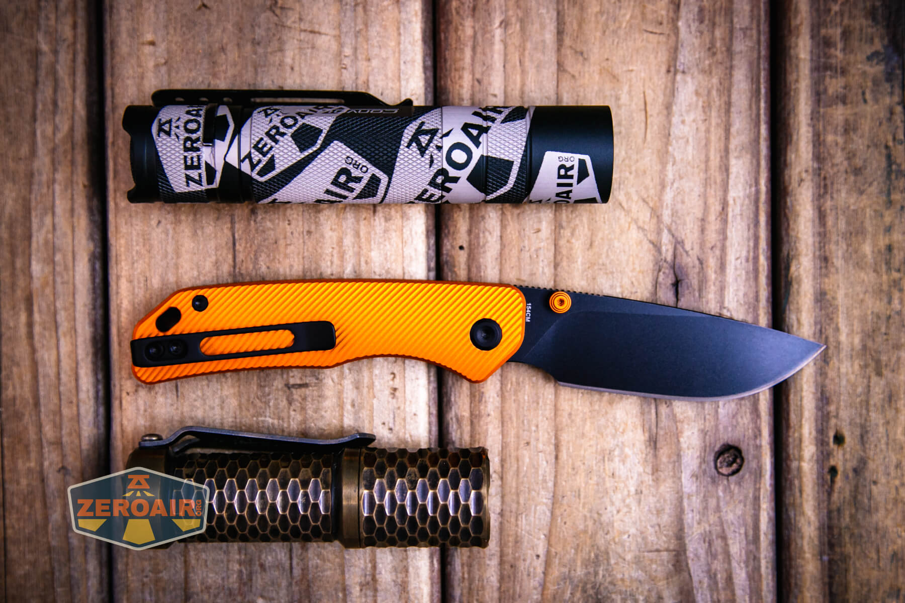 Vosteed Marten top liner lock knife with two standard sized flashlights