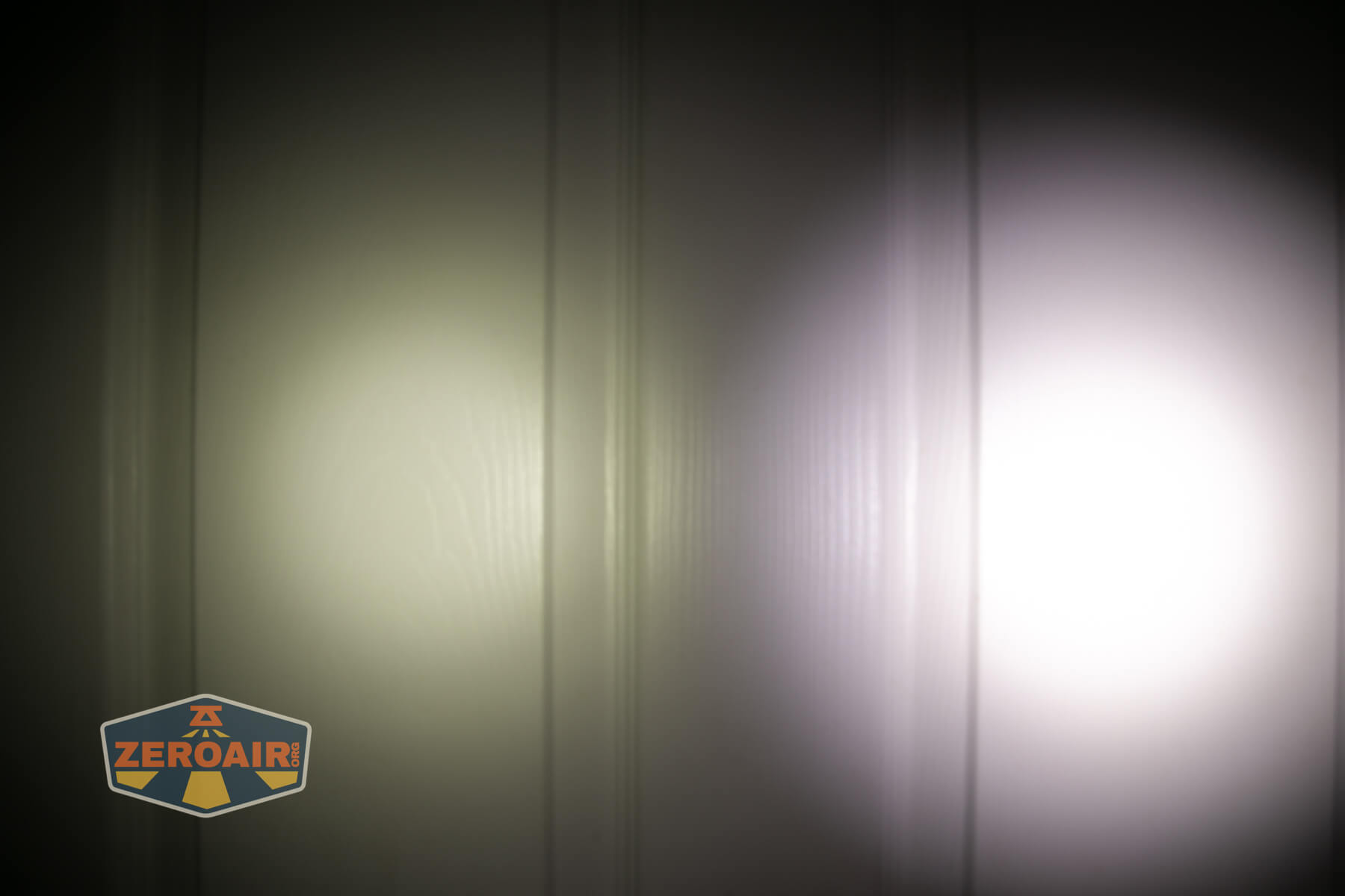 Wuben E8 modular flashlight beamshots on door (at 1') compared to nichia 219b 4500K