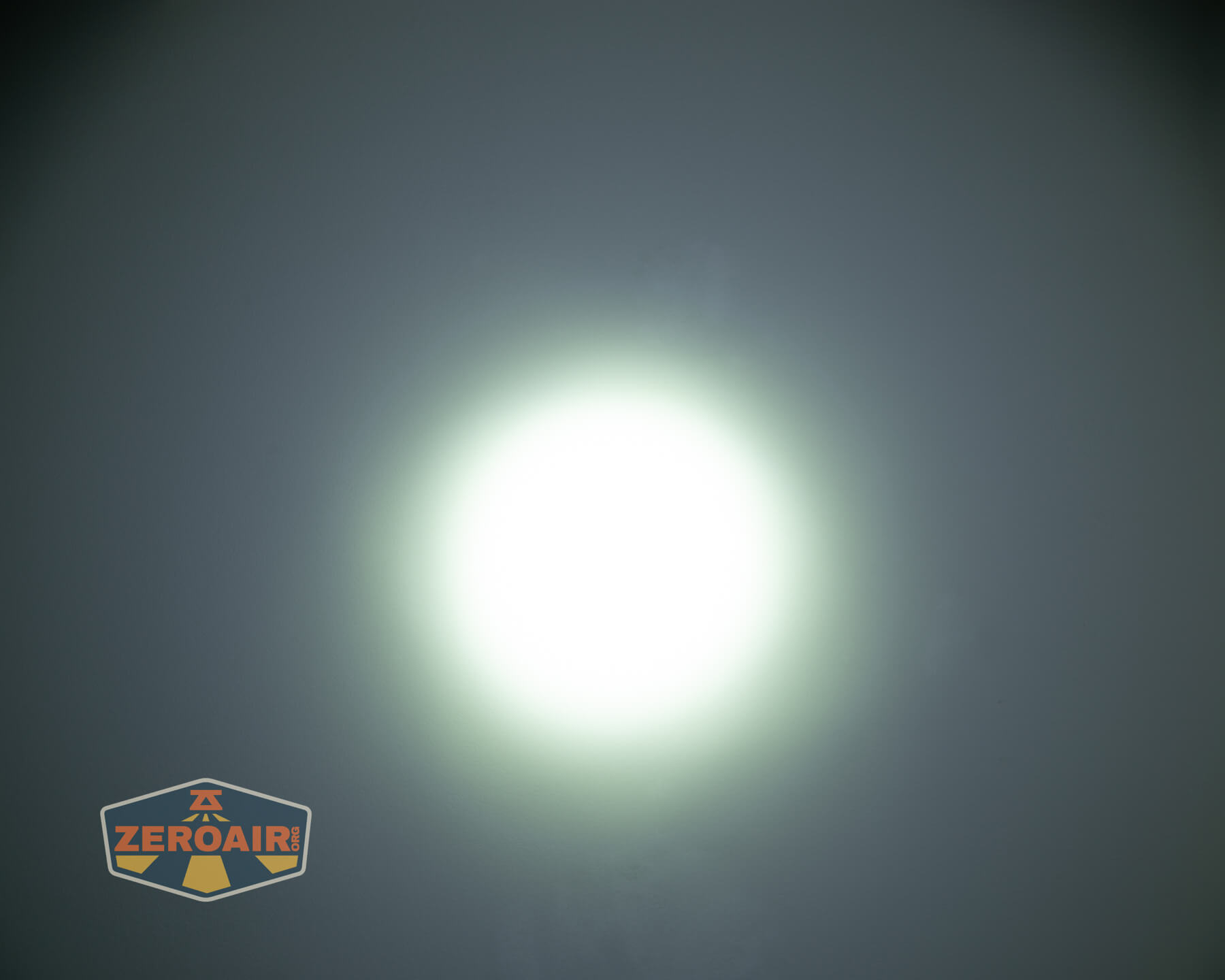 Wuben L3 flashlight beamshots on ceiling