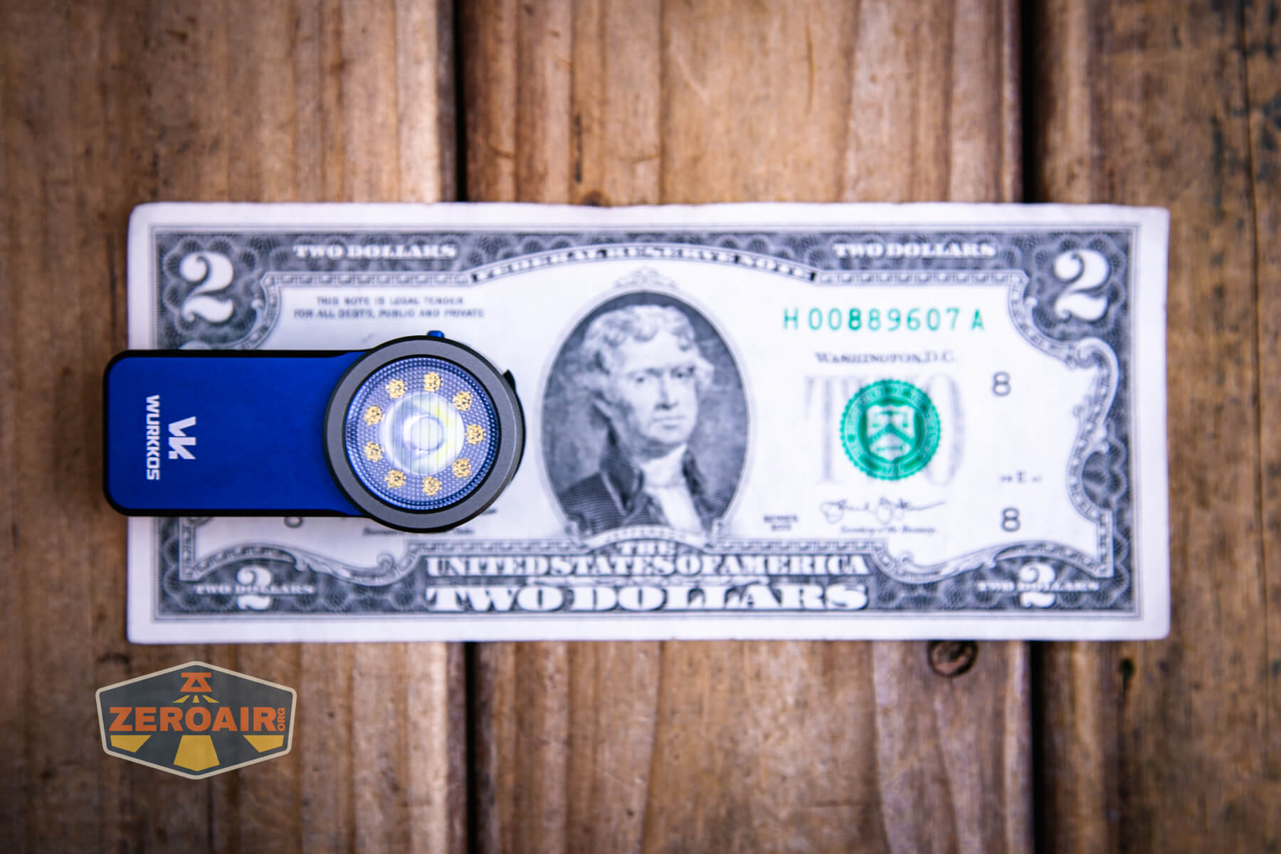 Wurkkos HD03 clip flashlight on a two dollar bill