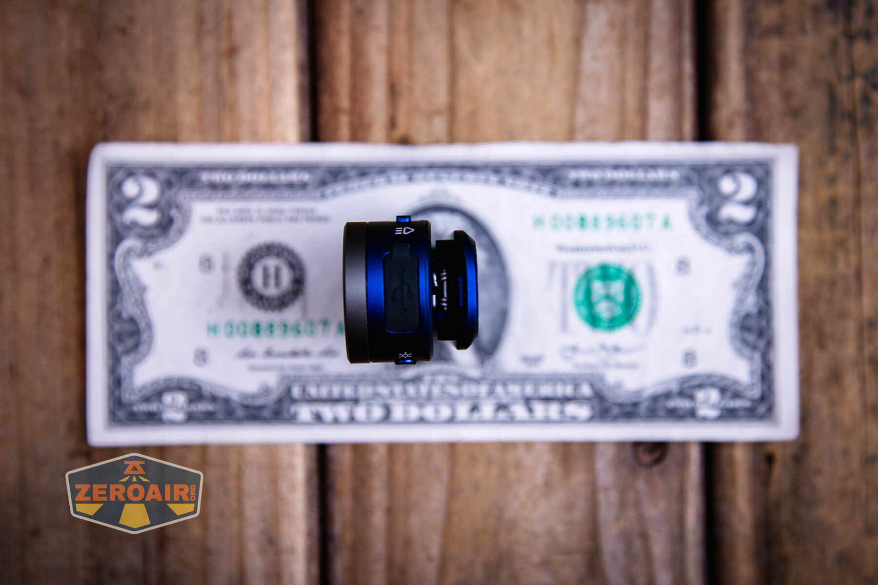 Wurkkos HD03 clip flashlight on a two dollar bill